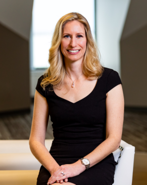 Sadie Rosethorn, founder and principal consultant of Sadie Rosethorn Consulting, seated in a professional setting.