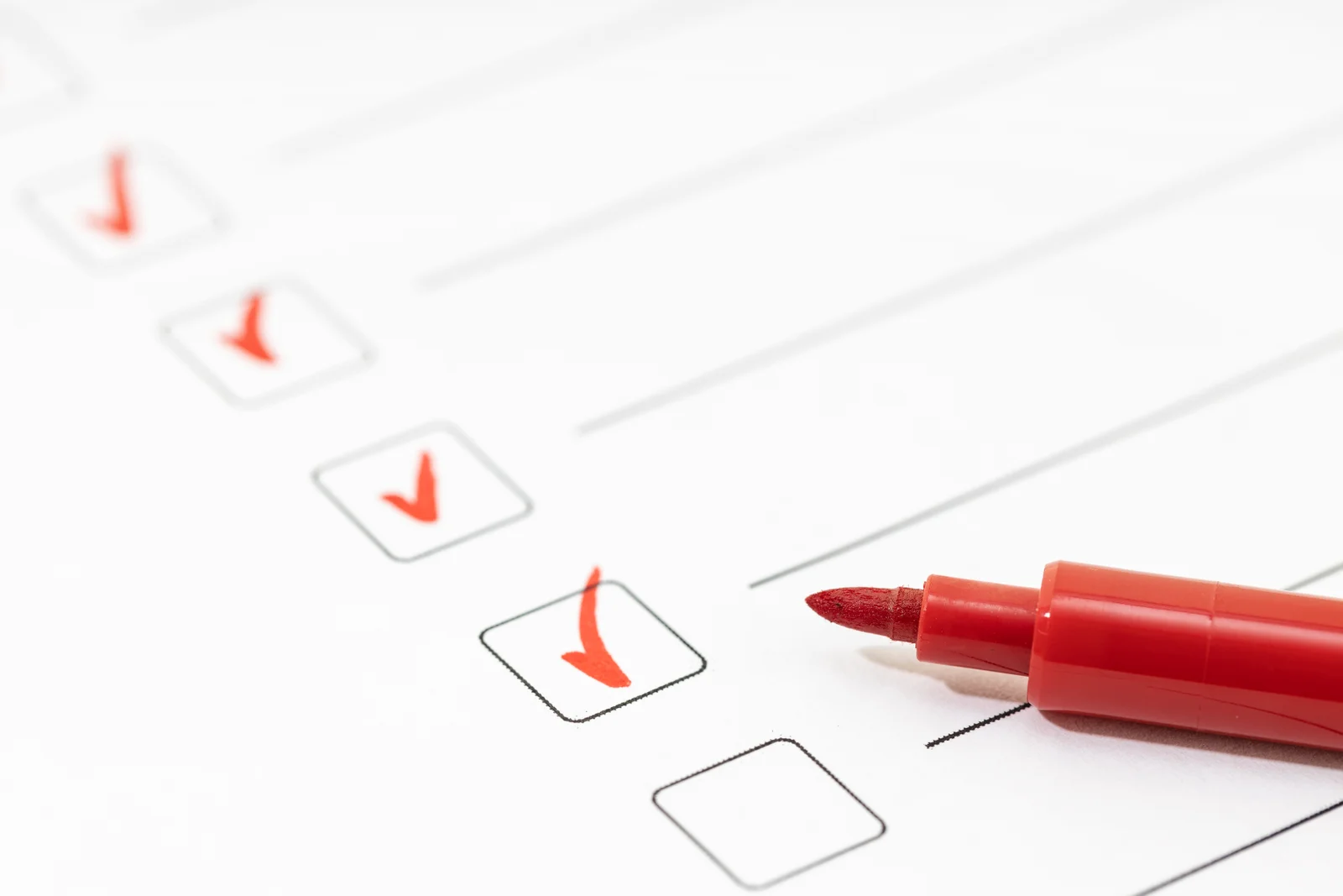 A checklist with checkmarks and a red pen, representing clear and intentional decision-making.